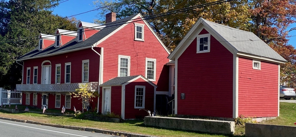 4 Townsend Street Pepperell, MA 01463 - Photo 2 of 27 a view of a house with a yard and plants