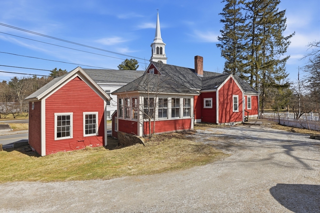 4 Townsend Street Pepperell, MA 01463 - Photo 3 of 27 a front view of a house with a yard