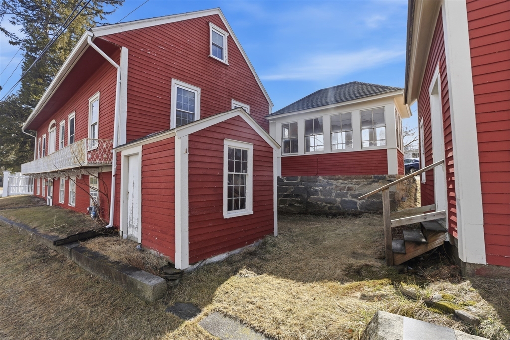 4 Townsend Street Pepperell, MA 01463 - Photo 4 of 27 a view of a house with a yard