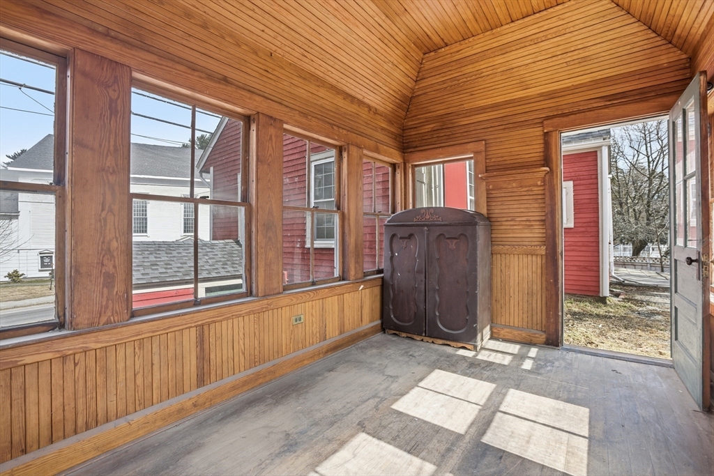4 Townsend Street Pepperell, MA 01463 - Photo 6 of 27 a view of an entryway with wooden floor and door