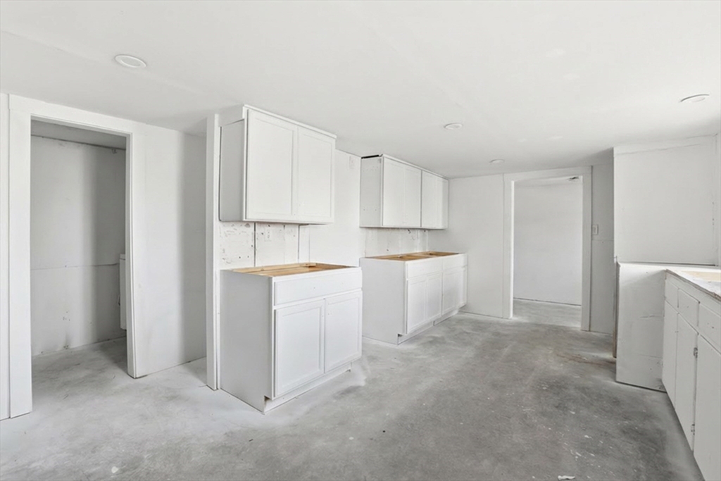 4 Townsend Street Pepperell, MA 01463 - Photo 10 of 27 a view of kitchen with white cabinets