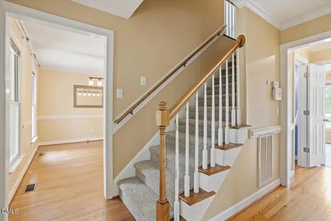 a view of entryway with wooden floor and door