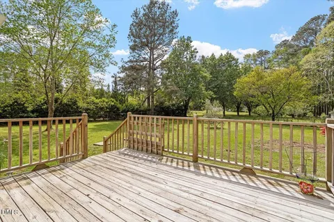 a view of wooden deck with a lake