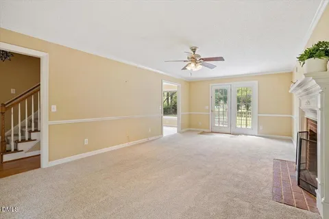 a view of an empty room with a fireplace