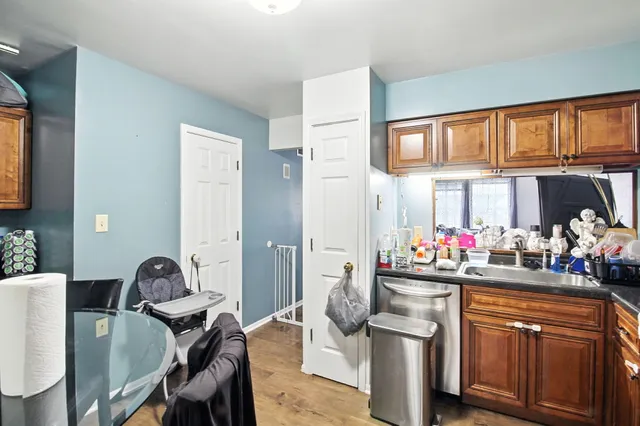 a view of a dining room with furniture and a window