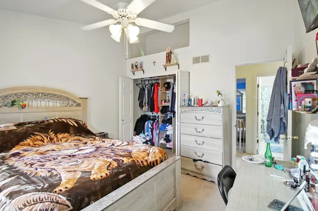 a bedroom with a bed and a cabinets
