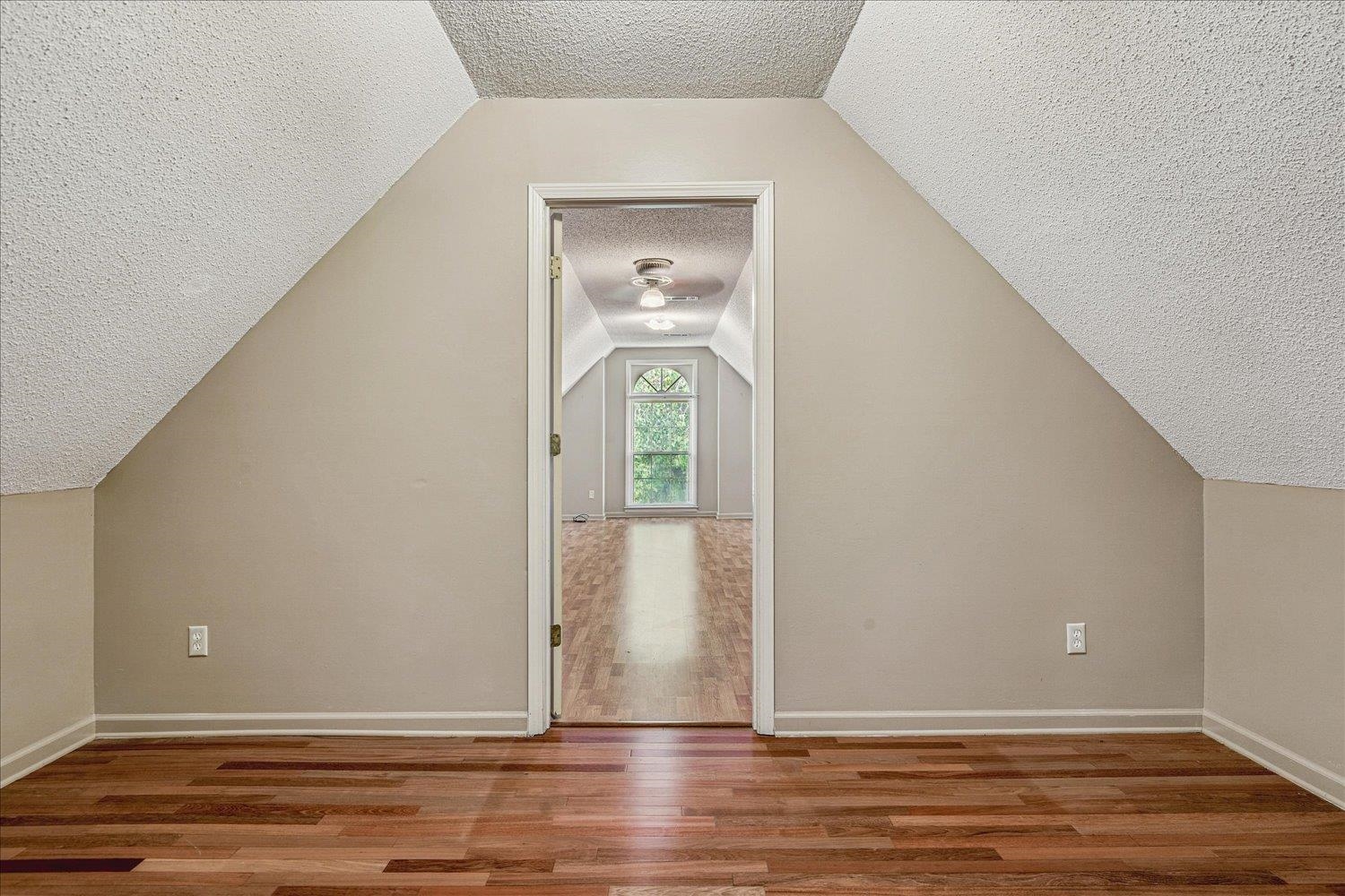 8529 Buckhurst Road Memphis, TN 38016 - Photo 29 of 36 Bonus room featuring wood finished floors and baseboards