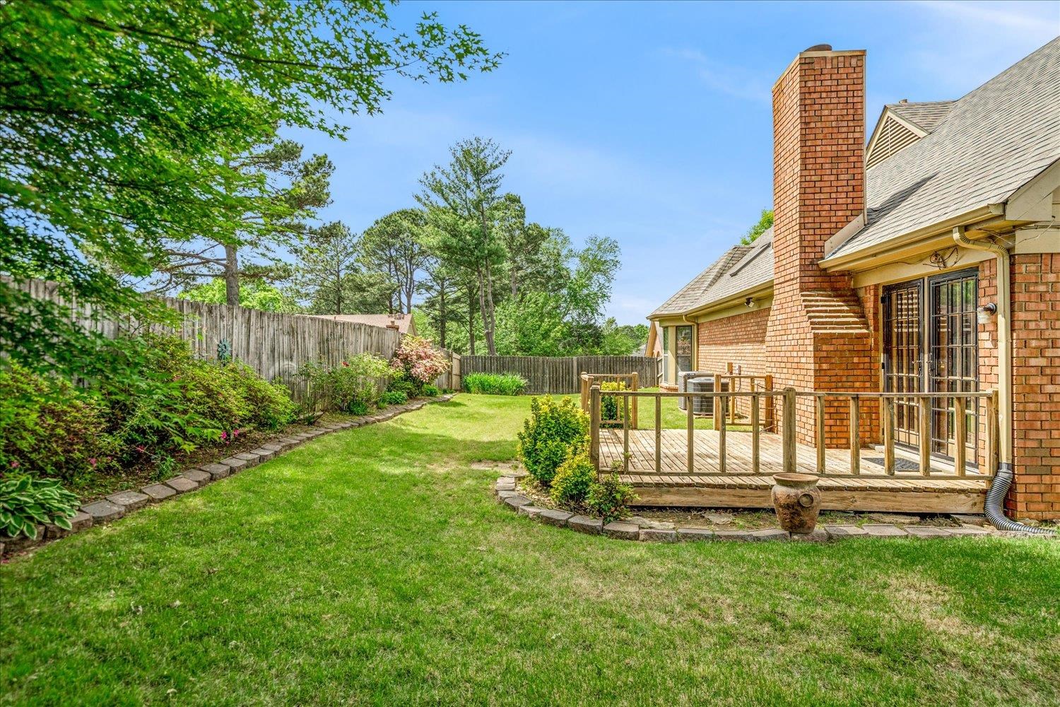 8529 Buckhurst Road Memphis, TN 38016 - Photo 34 of 36 Fenced backyard featuring a deck