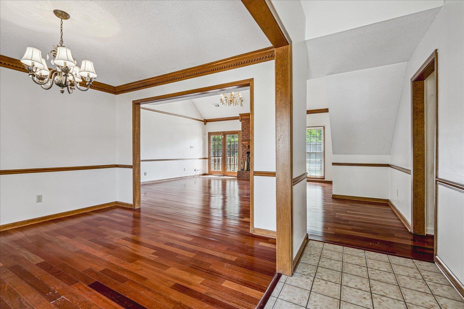 8529 Buckhurst Road Memphis, TN 38016 - Photo 6 of 36 Spare room featuring suspended lighting and light wood finished floors
