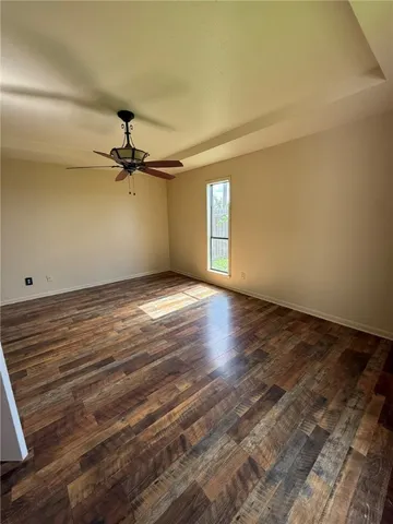 a view of hallway with wooden floor