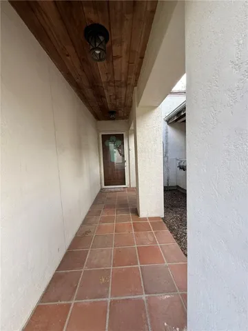 a view of an empty room with a bathroom