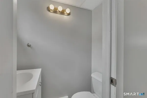 a bathroom with a toilet and a sink