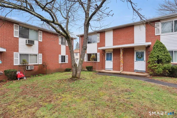 a house that has a big yard in front of it