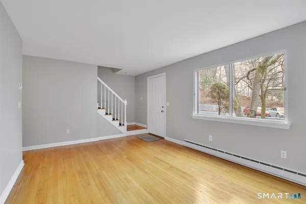a view of an empty room with a window