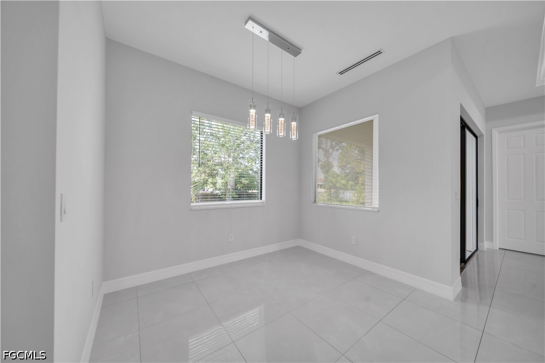 3509 38th Street Southwest Lehigh Acres, FL 33976 - Photo 14 of 47 a view of an empty room with a window