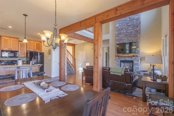 a living room with fireplace furniture and a wooden floor