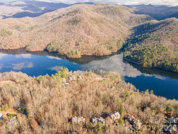 a view of a lake with a yard