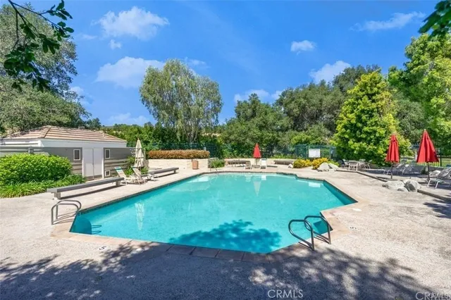 a view of a swimming pool with a lounge chairs
