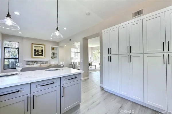 a view of a kitchen counter space with wooden floor
