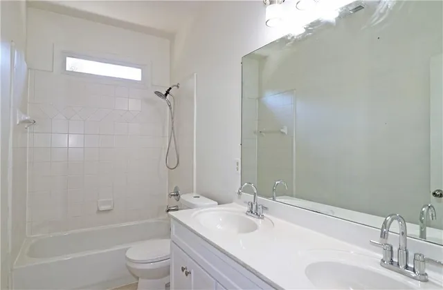 a bathroom with a sink toilet tub and shower
