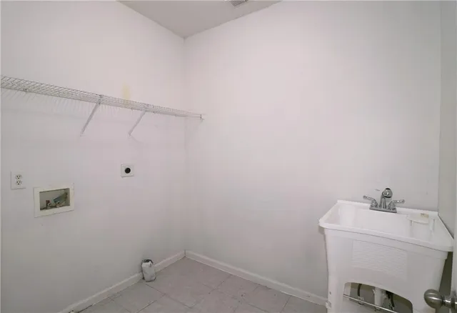 a bathroom with a sink and vanity