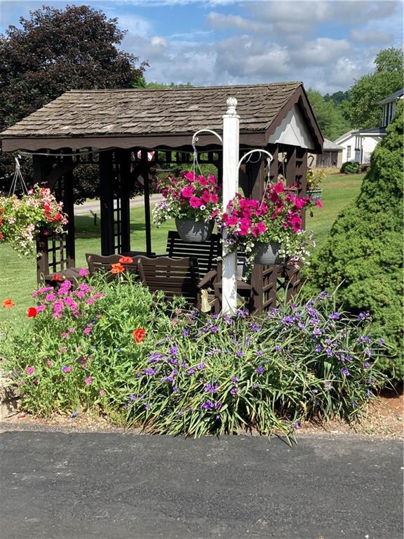 26 Paxton Road Sandy Lake, PA 16145 - Photo 4 of 23 an outdoor space with plants