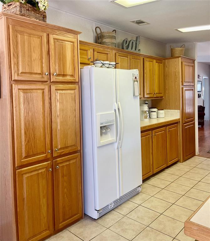 11200 Walsingham Road, Unit 139 Largo, FL 33778 - Photo 10 of 13 a white refrigerator freezer sitting in a kitchen