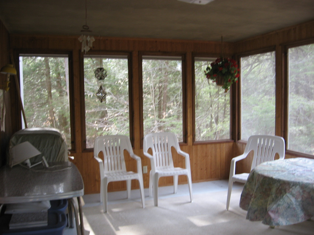 219 Slope Road Tolland, MA 01034 - Photo 14 of 21 a living room with furniture and a floor to ceiling window