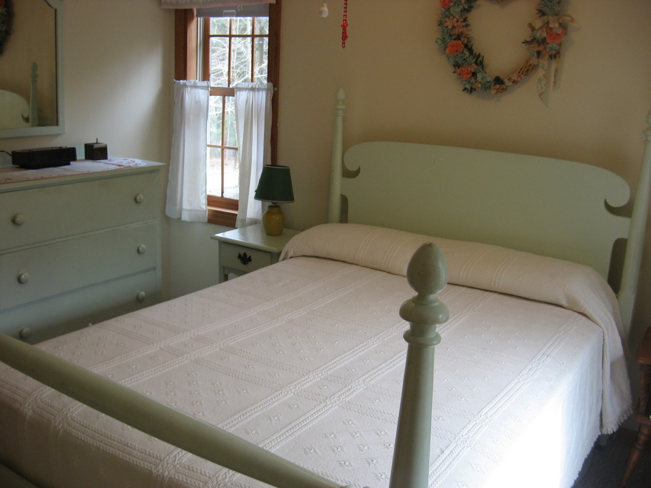 219 Slope Road Tolland, MA 01034 - Photo 17 of 21 a bedroom with a bed and windows