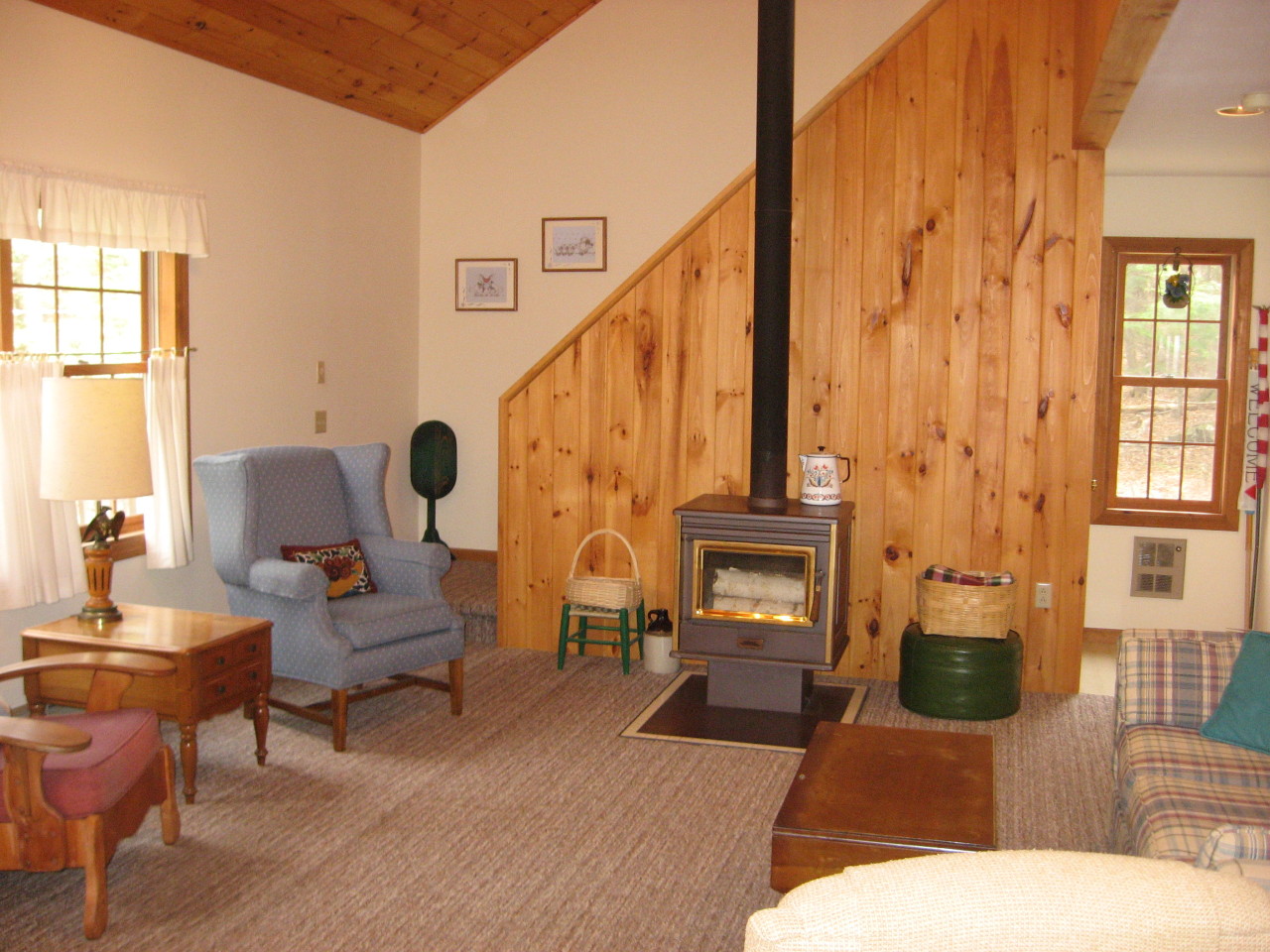 219 Slope Road Tolland, MA 01034 - Photo 21 of 21 a living room with fireplace furniture and a window