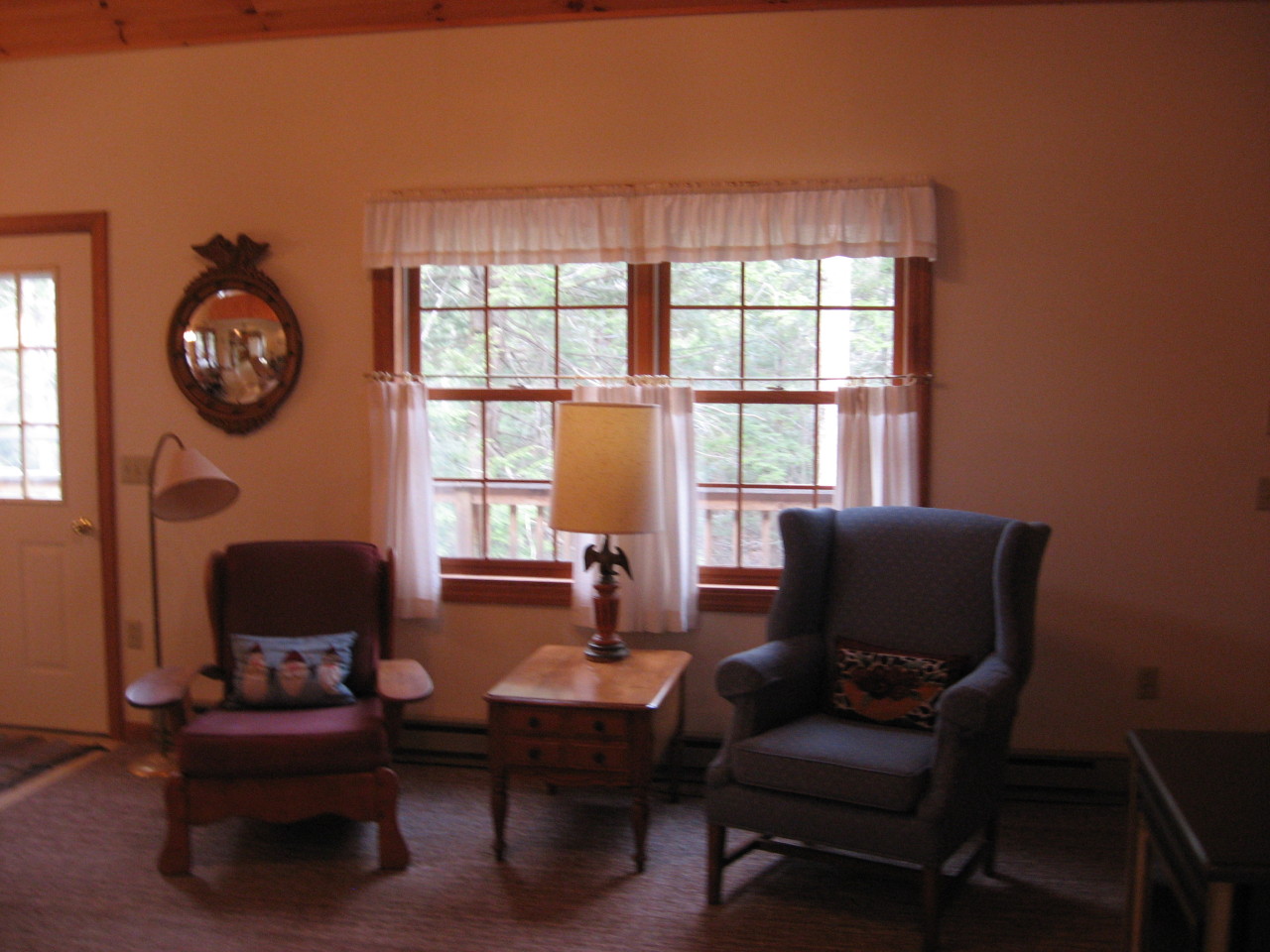 219 Slope Road Tolland, MA 01034 - Photo 3 of 21 a living room with furniture a fireplace and a floor to ceiling window