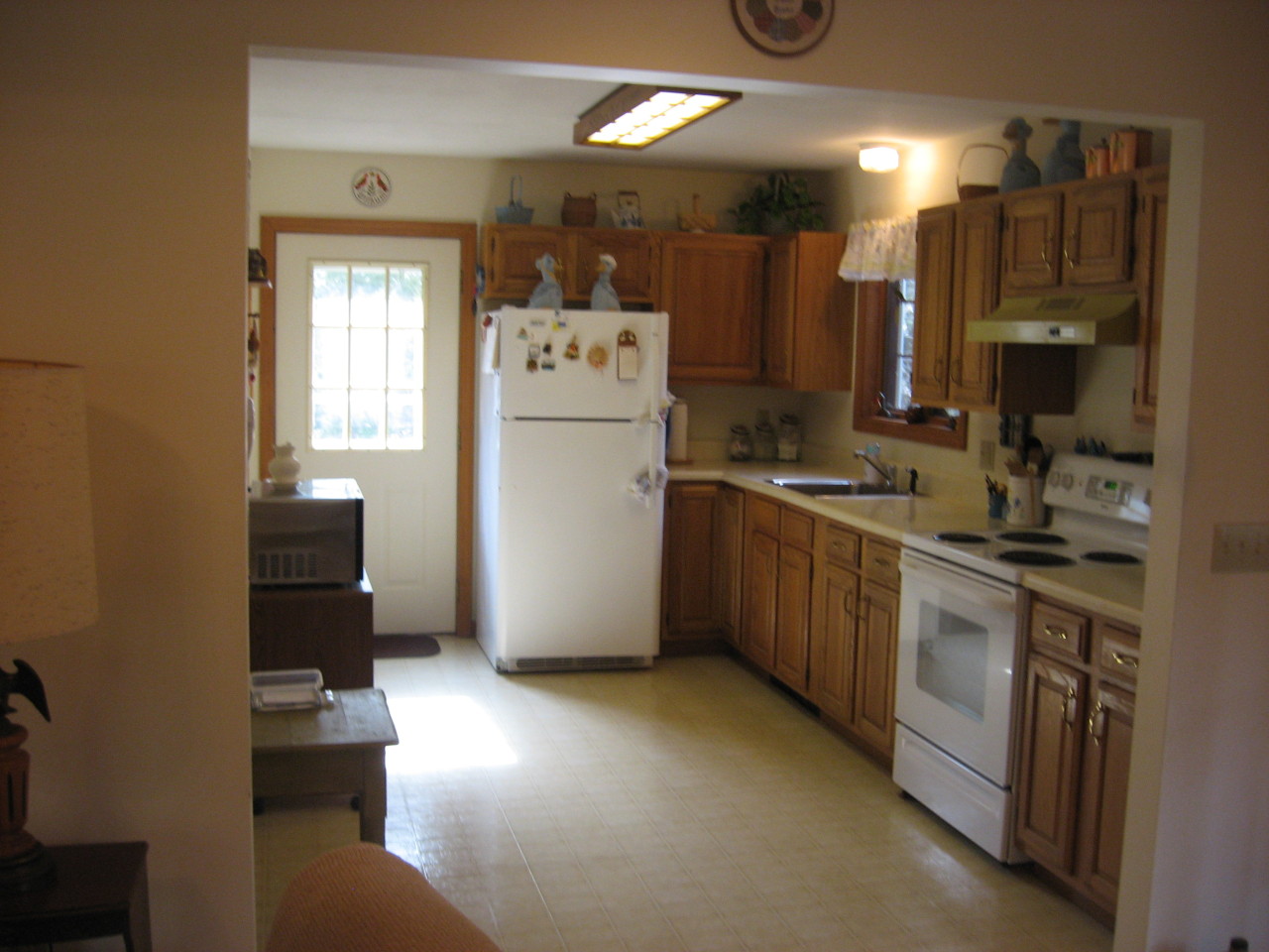 219 Slope Road Tolland, MA 01034 - Photo 7 of 21 a kitchen with a refrigerator a stove top oven a sink and dishwasher