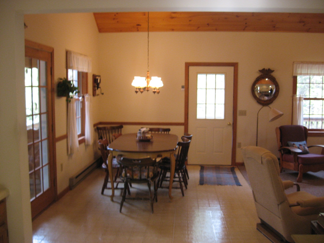 219 Slope Road Tolland, MA 01034 - Photo 9 of 21 a view of a dining room with furniture and wooden floor