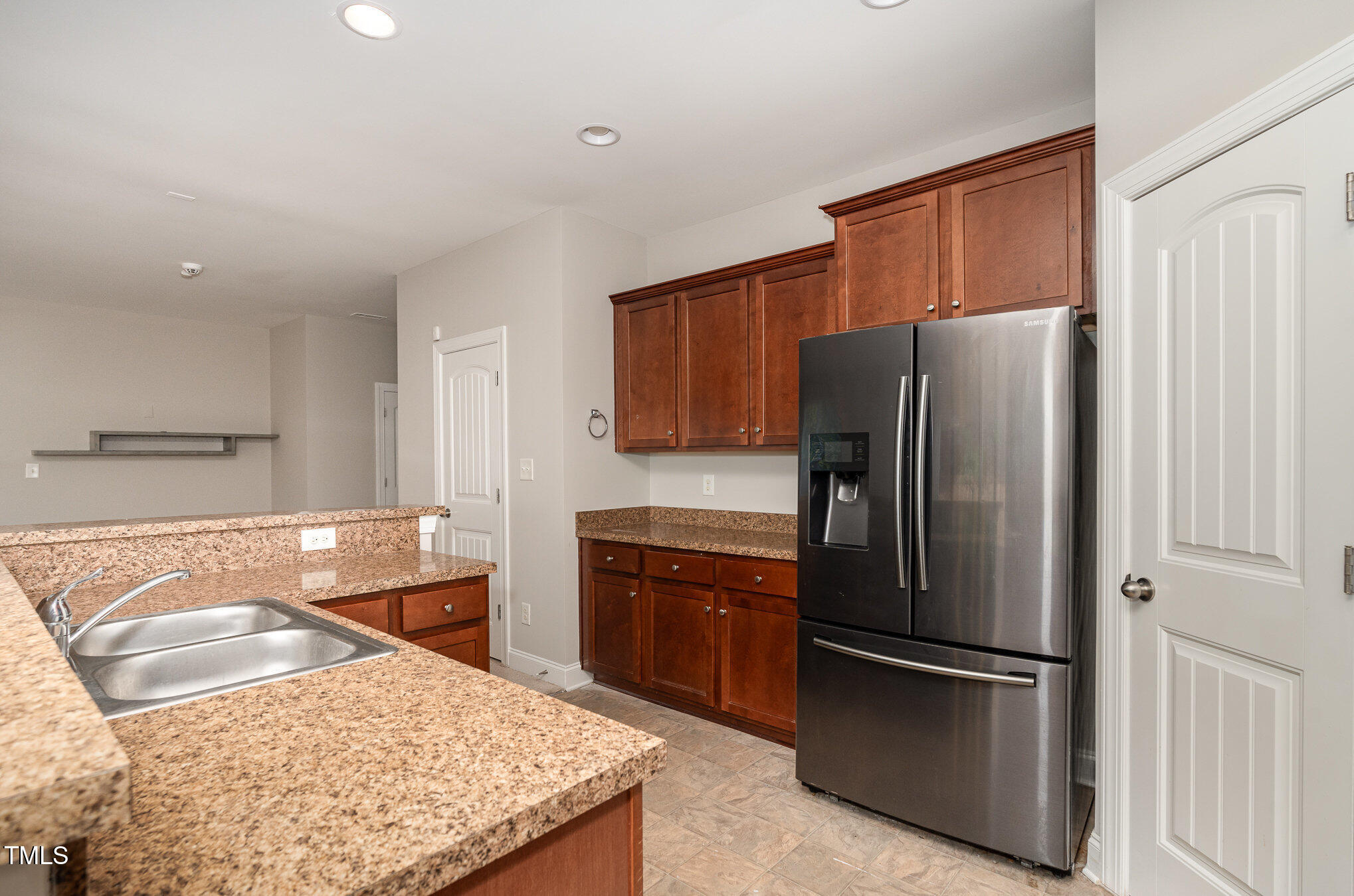 3529 Eastern Branch Road Raleigh, NC 27610 - Photo 11 of 29 a kitchen with stainless steel appliances granite countertop a refrigerator and a stove top oven