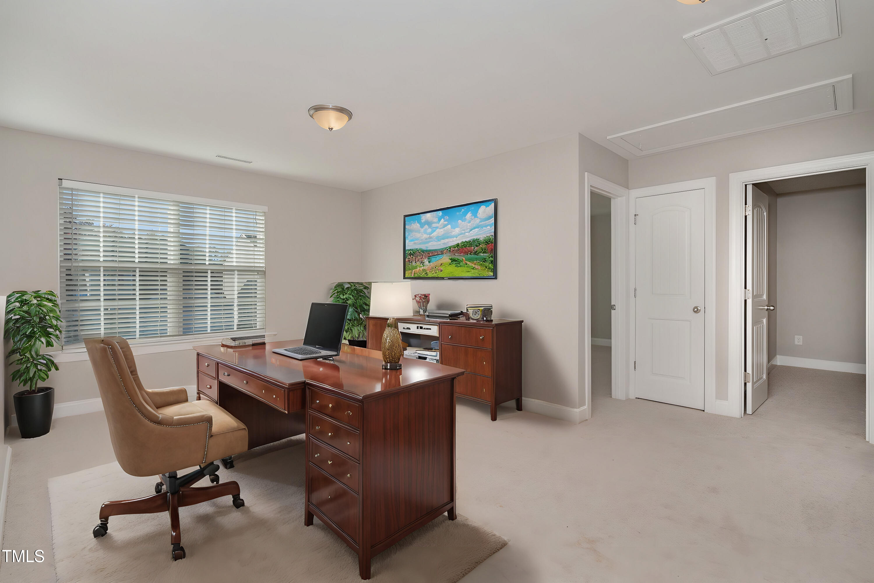 3529 Eastern Branch Road Raleigh, NC 27610 - Photo 13 of 29 a view of a workspace with furniture and a window