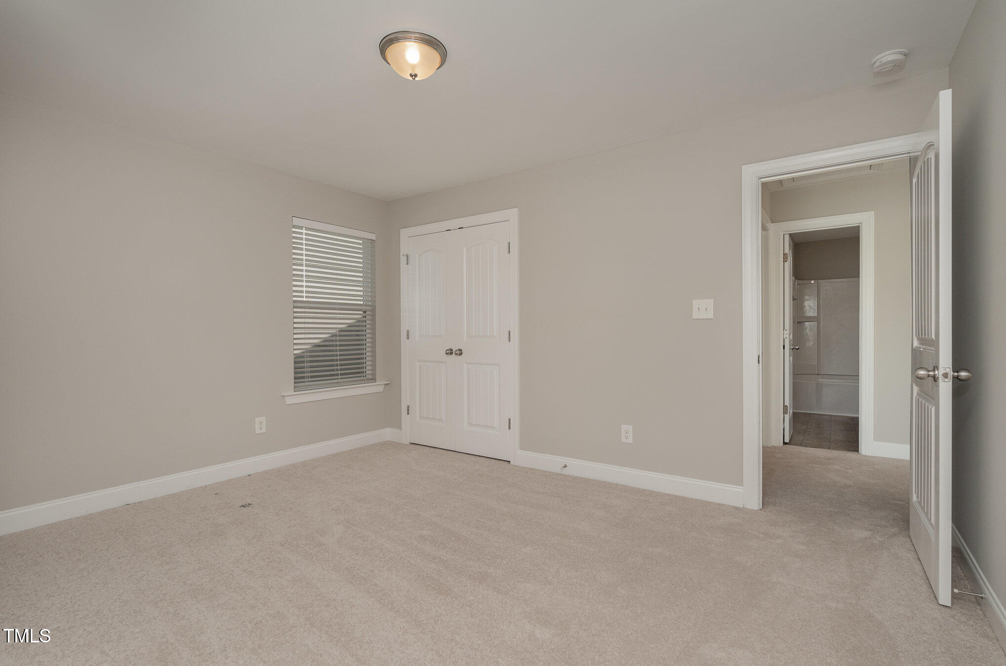 3529 Eastern Branch Road Raleigh, NC 27610 - Photo 22 of 29 an empty room with windows and closet