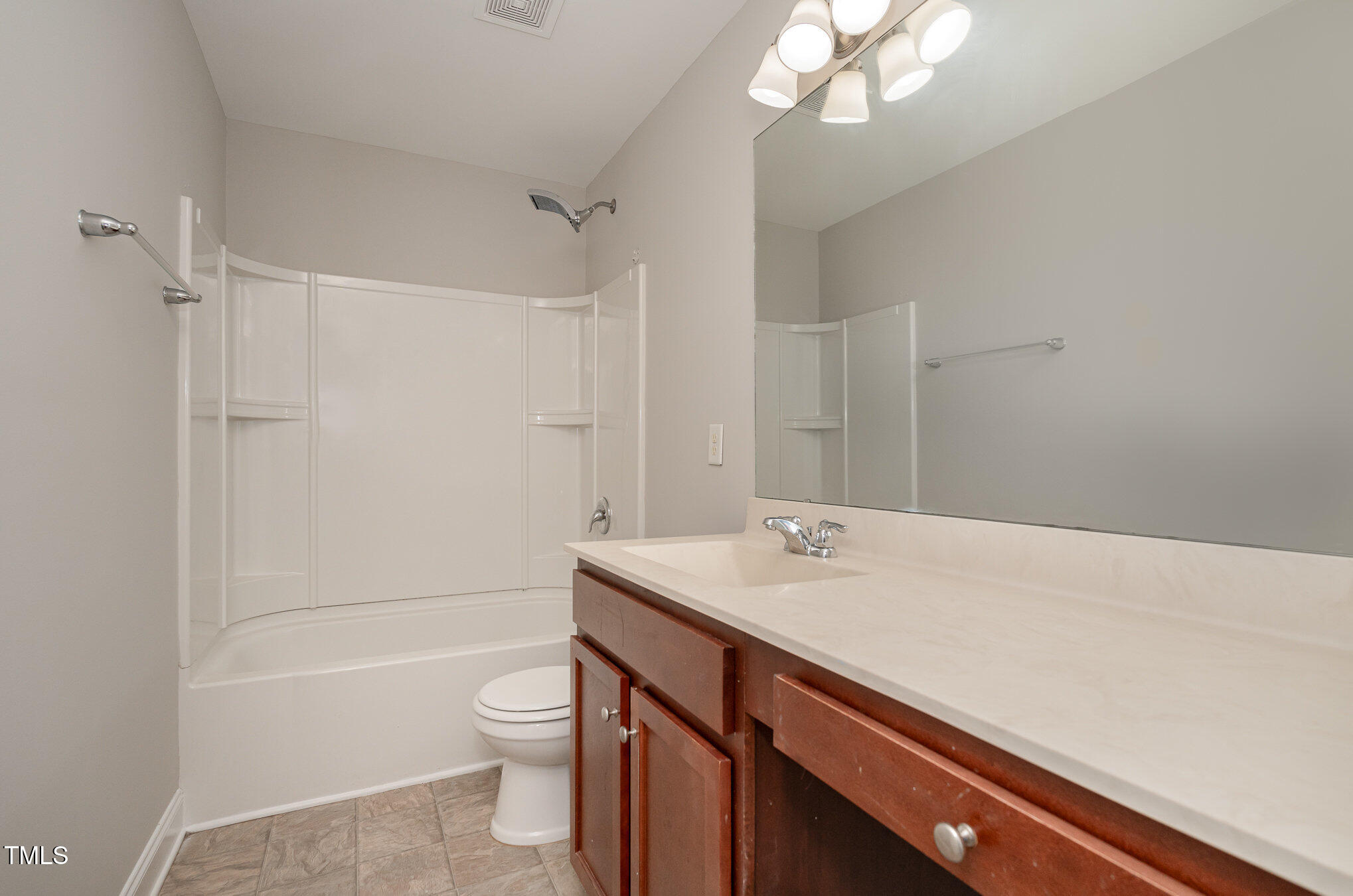 3529 Eastern Branch Road Raleigh, NC 27610 - Photo 25 of 29 a bathroom with a sink a toilet and shower