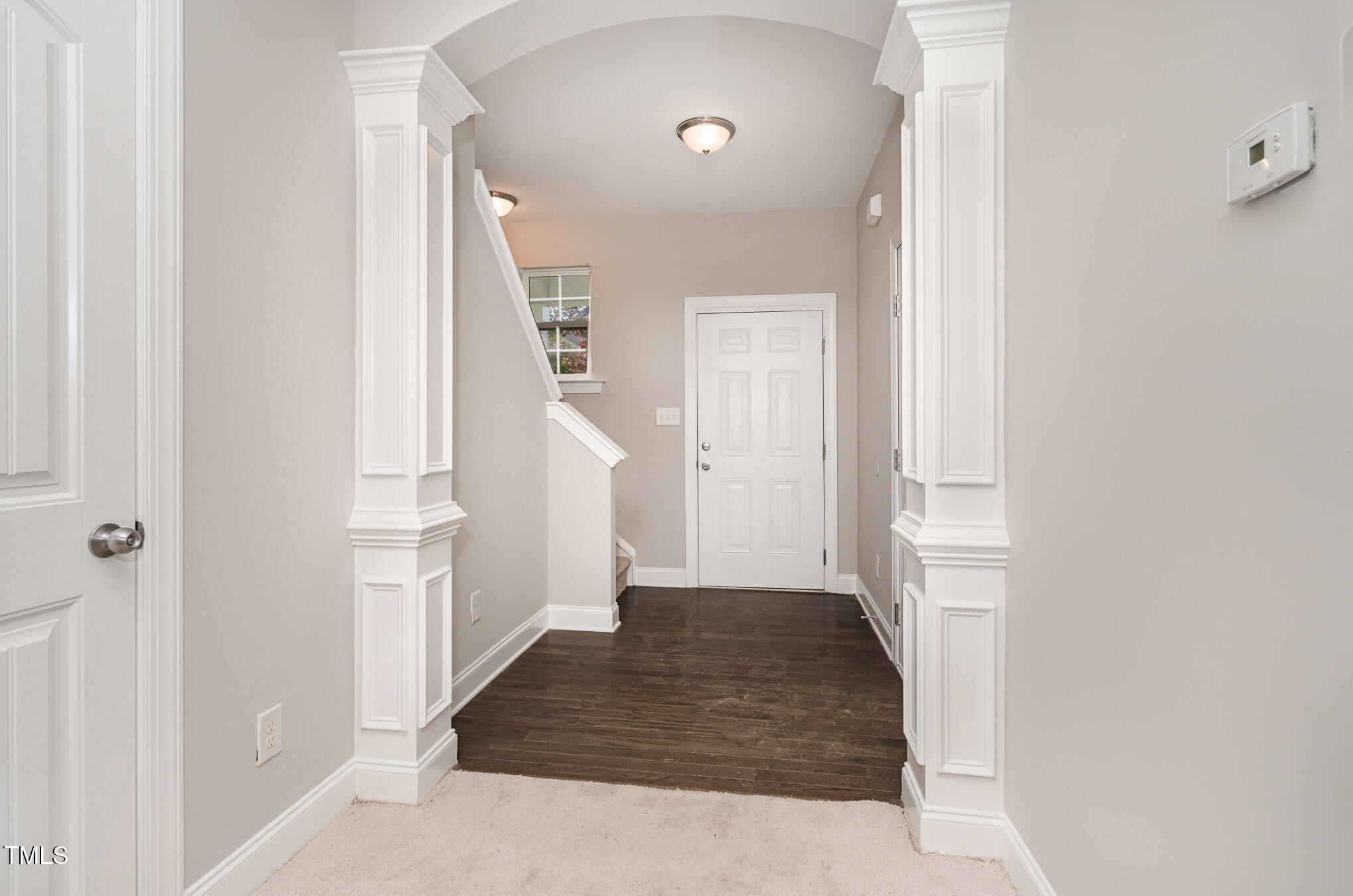 3529 Eastern Branch Road Raleigh, NC 27610 - Photo 3 of 29 a view of a hallway with white walls and stairs