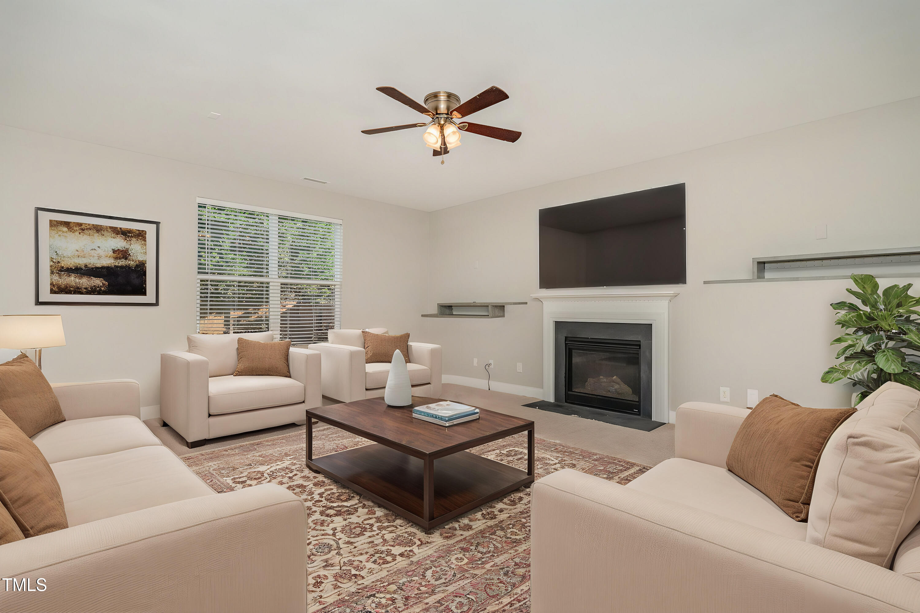 3529 Eastern Branch Road Raleigh, NC 27610 - Photo 4 of 29 a living room with furniture fireplace and a flat screen tv