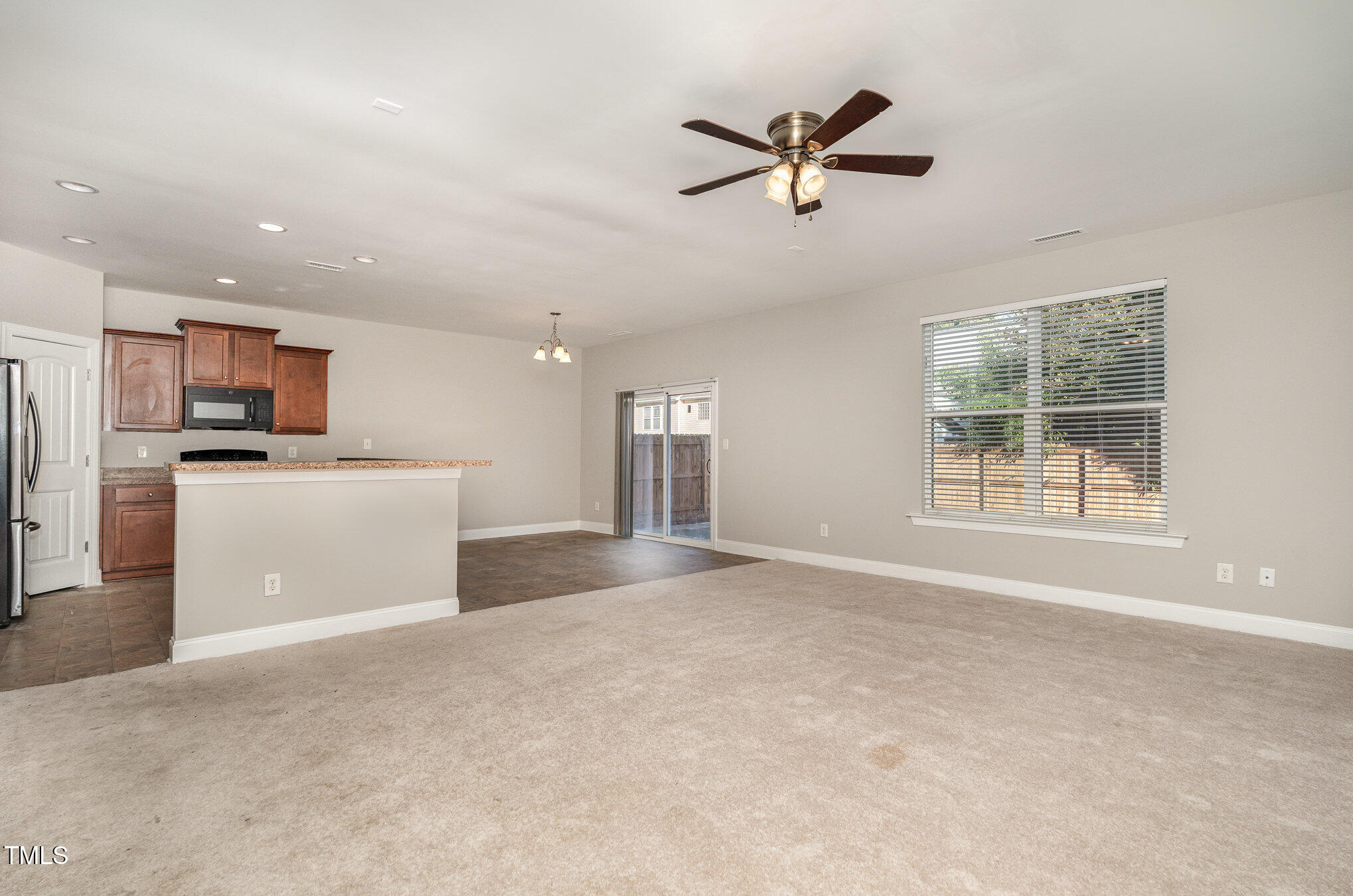3529 Eastern Branch Road Raleigh, NC 27610 - Photo 7 of 29 a view of a kitchen with a sink dishwasher and a refrigerator