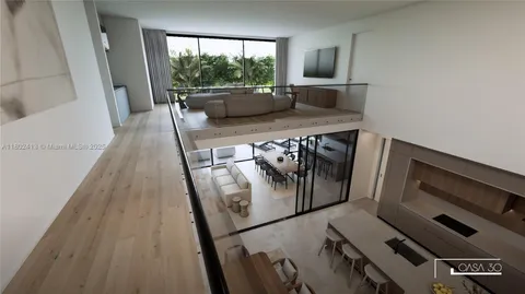 a bedroom with a bed and large window