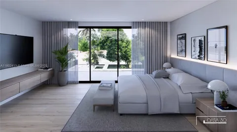 a en suite bathroom with double vanity and a mirror