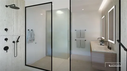 a front view of a house with plants