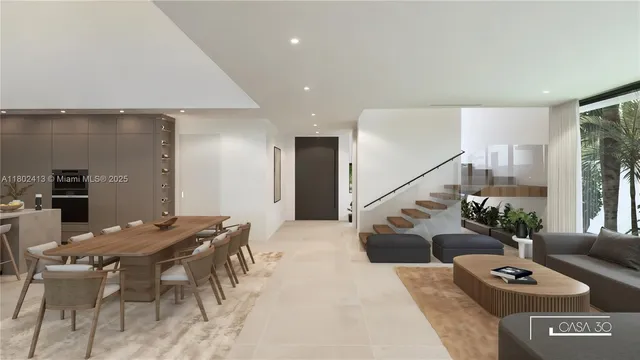 a kitchen with stainless steel appliances kitchen island granite countertop a table chairs sink and cabinets