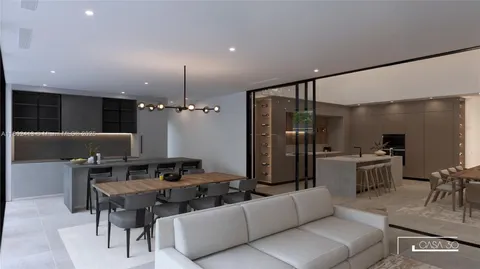 a kitchen with a sink and chairs