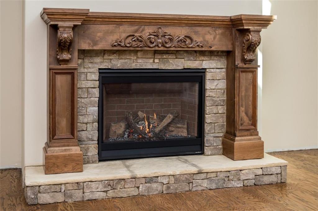 1 Cox Road Roswell, GA 30075 - Photo 28 of 30 a fireplace with a vase on top of it