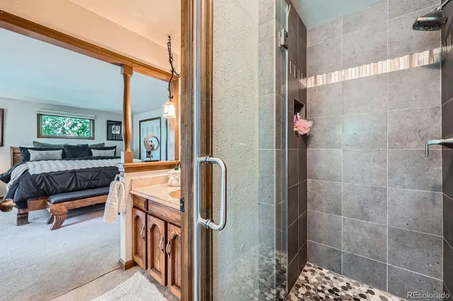 a en suite bathroom with sink and mirror