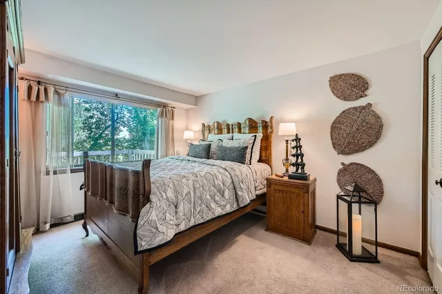 a bed room with a bed and a window