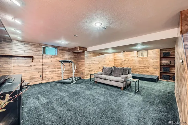 a living room with furniture and large window