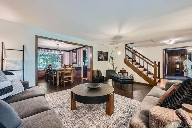a living room with furniture and a table